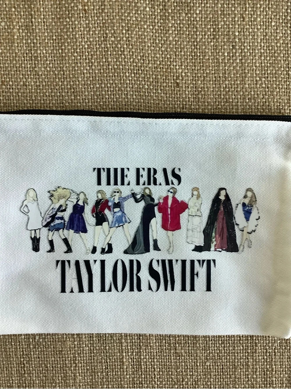 Five Taylor Swift White 'The Eras' Zip Pouches with Multicolor Illustration
